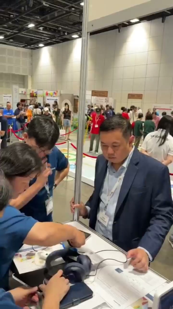 Visitors and the Sentinan team discussing a demonstration at the ELDEX Asia 2026 booth.