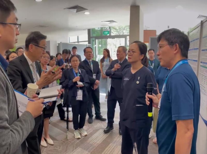 Discussion at the symposium exhibition, shared with Sentinan's Hospital@Home research update.